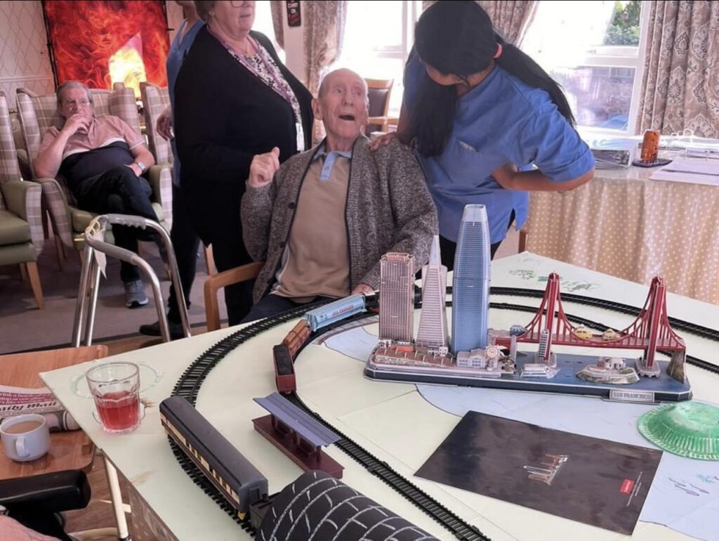 Residents of Haddington Care Home enjoying a travel-themed interactive session.