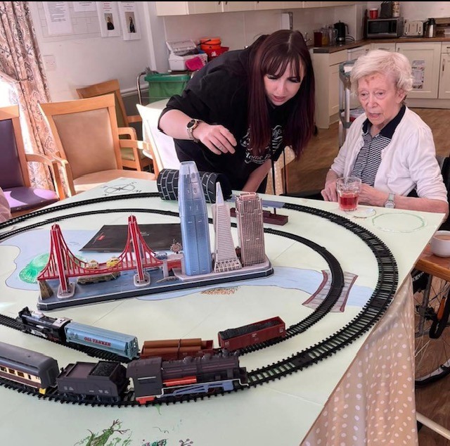 Residents of Haddington Care Home enjoying a travel-themed interactive session.