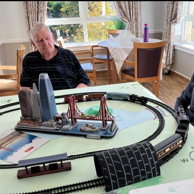 Residents of Haddington Care Home enjoying a travel-themed interactive session.