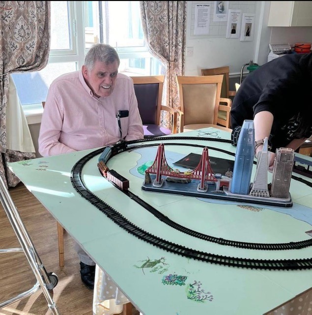 Residents of Haddington Care Home enjoying a travel-themed interactive session.