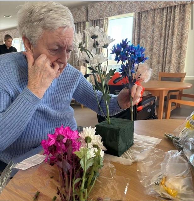 Resident arranging flowers