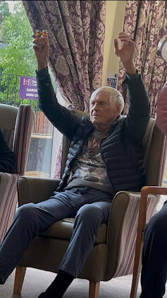 roy enjoying a seated exercise activity