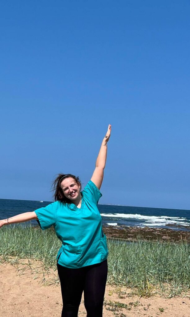 haddington care home staff member smiling at the beach