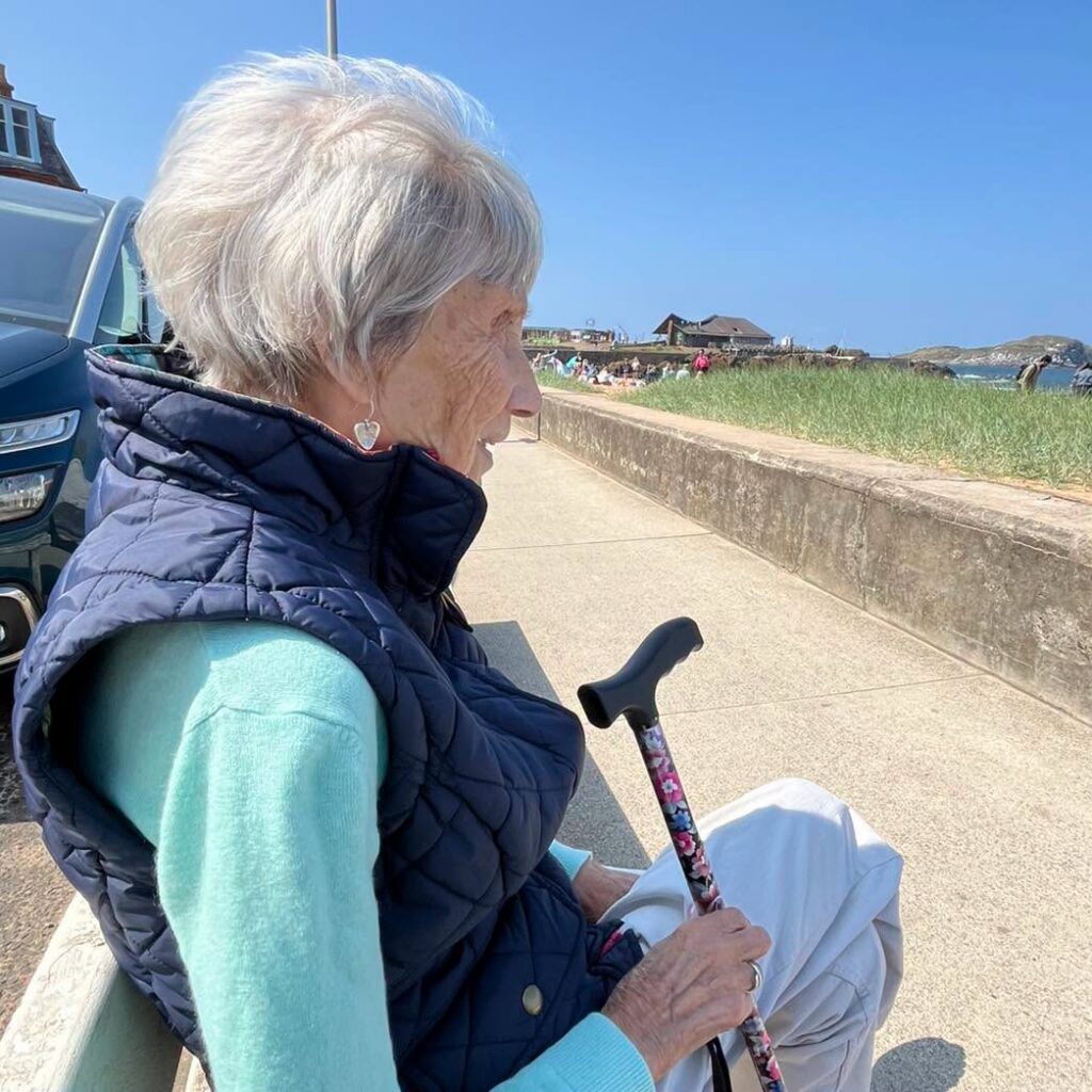 care home resident looking at the sea